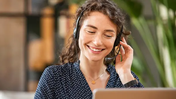Service desk consultant talking in a call centre Service desk consultant talking in a call centre