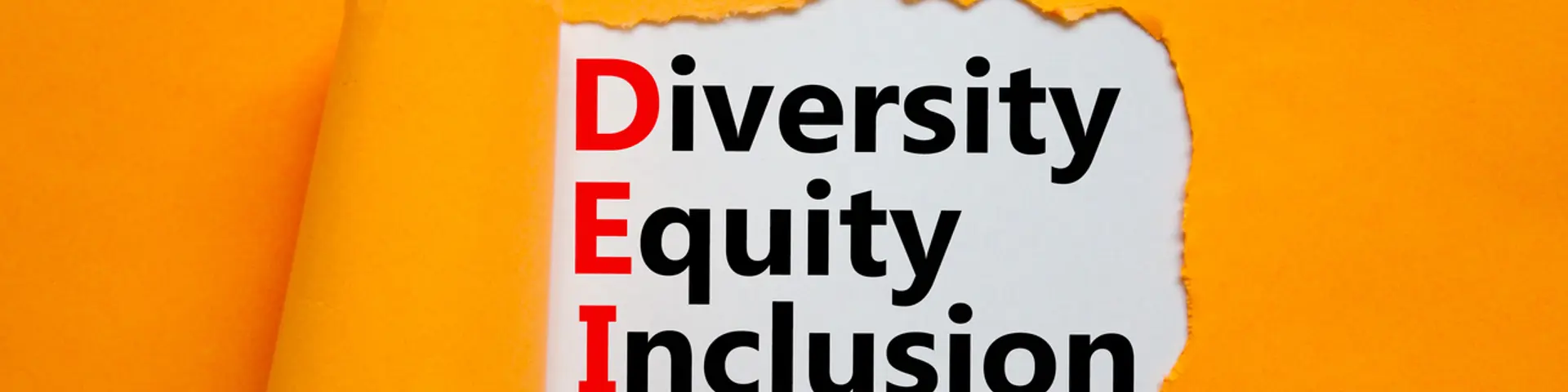 Words DEI, diversity, equity, inclusion appearing behind torn orange paper Words DEI, diversity, equity, inclusion appearing behind torn orange paper